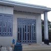 Mẫu cửa sắt kính màu ghi sáng cho nhà thêm đẹp