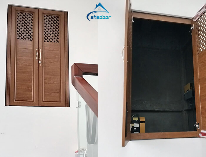 Cửa lá hộp nhôm màu vân gỗ nan lấy thoáng cho phòng kỹ thuật thang máy